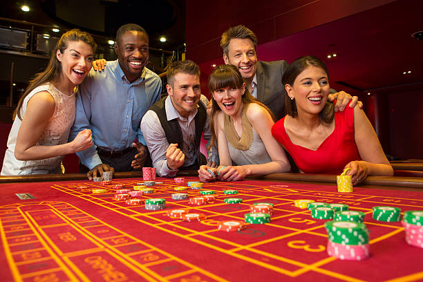 kenzo slots interface on a mobile phone showing reel grid, stake selector, spin button, and current balance